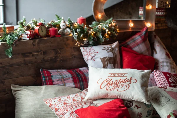 Cozy bed with Christmas pillows decorated with Christmas decor — Stock Photo, Image