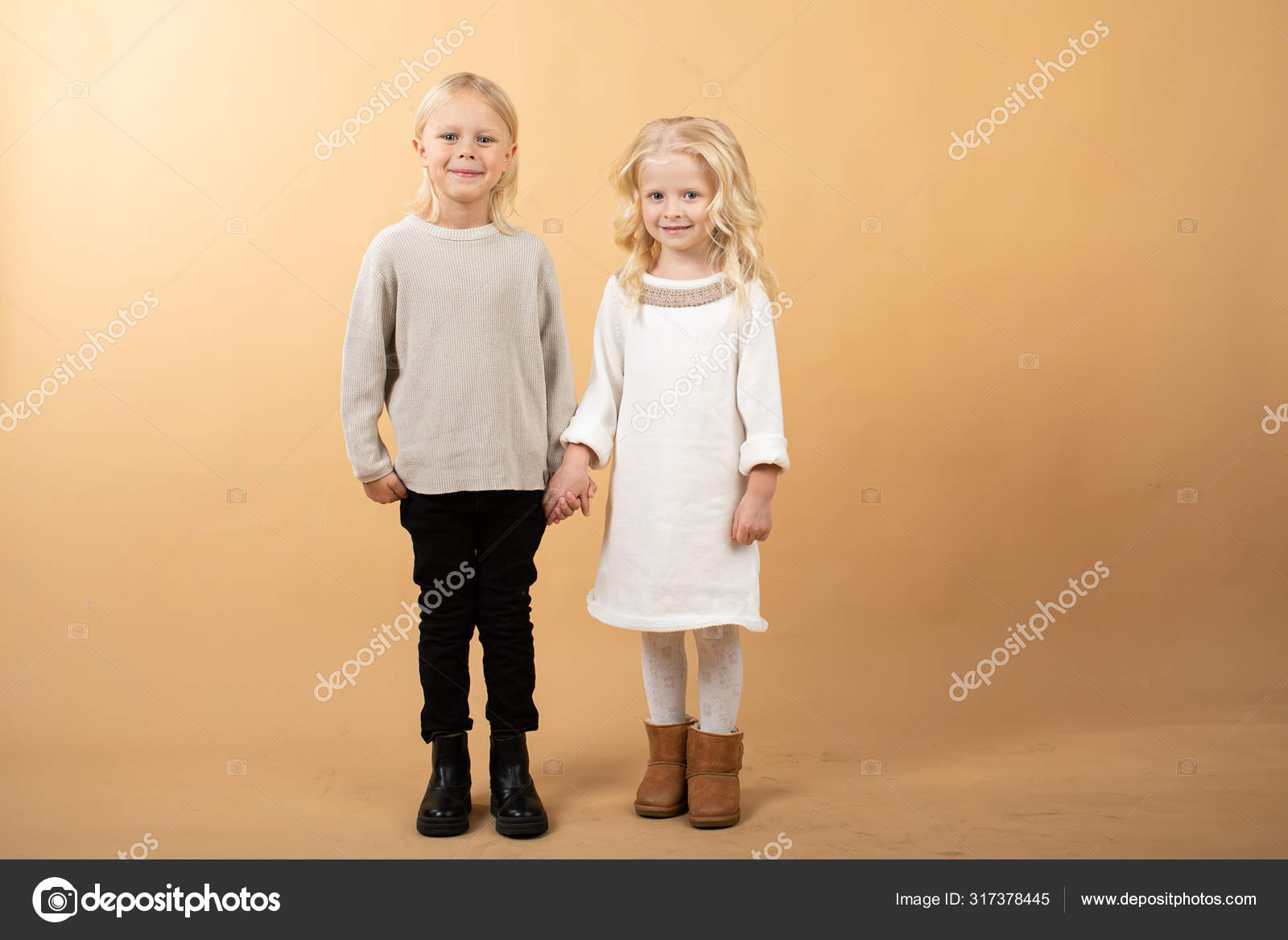 A Little Girl In A White Knitted Dress And A Black Hat And A Boy In A Sweater Children Holding Hands Stock Photo By C Adrinn A Little Girl In A White Knitted Dress And A Black Hat And A Boy In A Sweater Children Holding Hands Stock Photo By C Adrinn