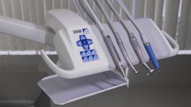 The workplace of the dentist with the dental unit and chair, close-up