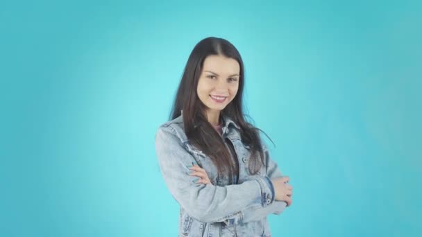 Smiling Brunette in a Denim Jacket Blows a Kiss to the Camera — Stockvideo