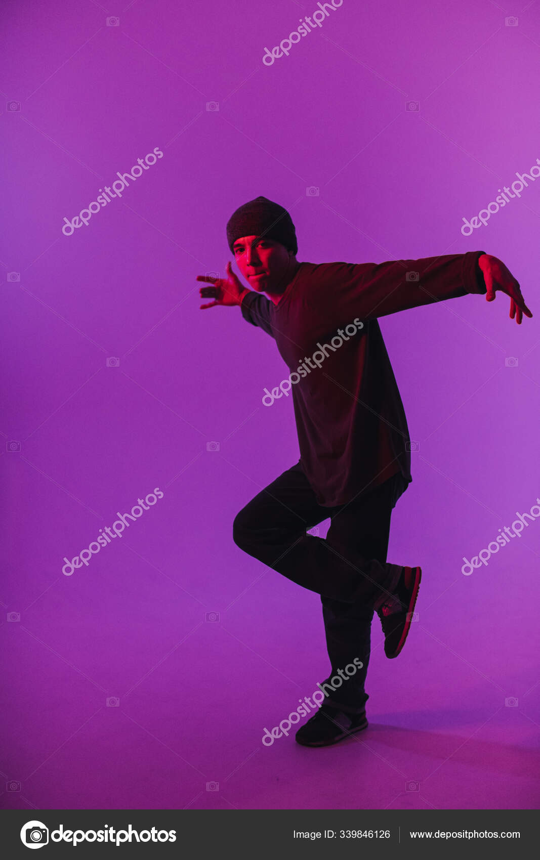 Young Man in a Jumper Dancing Contemporary Dance in Studio. Breakdancing.  Dance School Poster. Copy Space. Battle competition announcement. Pink and  Blue Background. Stock Photo by ©Adrinn 339846126