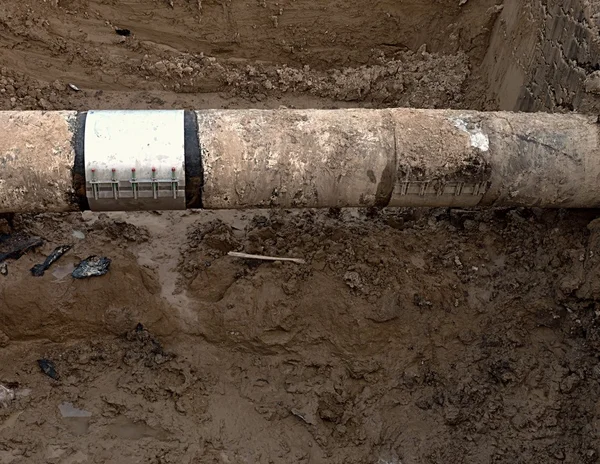 Big drink water pipes joined with  stainless repairing sleeve members — Stock Photo, Image