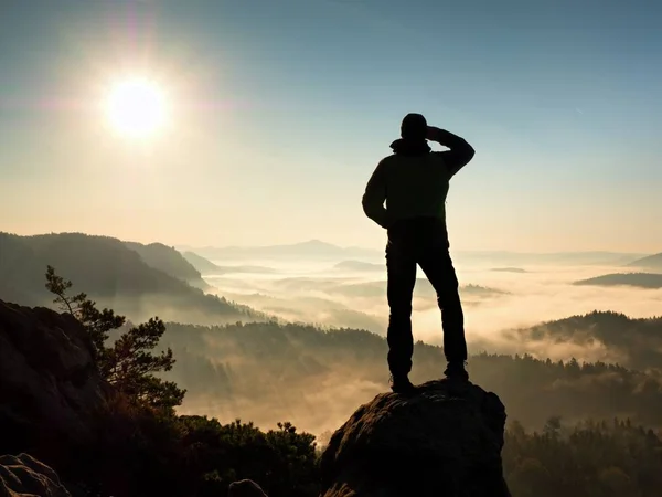 Man silhouette stay on sharp rock peak. Satisfy hiker enjoy view. — Stock Photo, Image