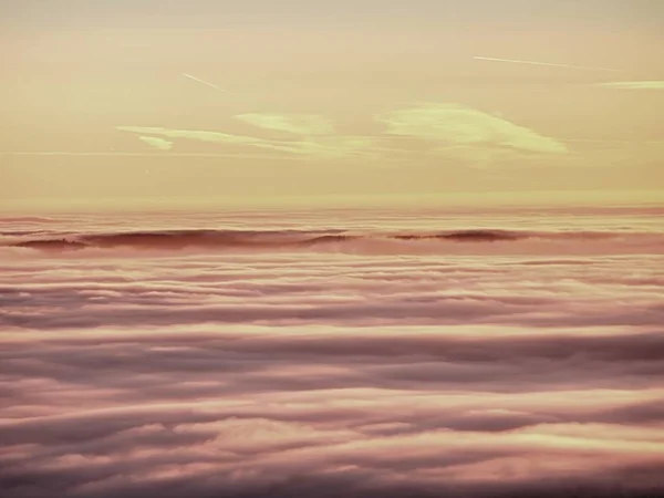 Pink orange sun rise above misty winter mountains — Stock Photo, Image