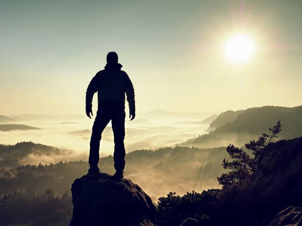 Man silhouette stay on sharp rock peak. Satisfy hiker enjoy view. — Stock Photo, Image