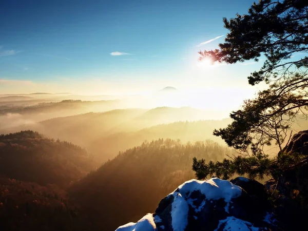 First powder snow cover on sandstone rocks above valley park. Heavy mist in valley bellow view point. Chilly autumnal foggy weather bellow. — Stock Photo, Image