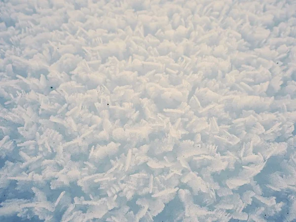 Estuctura de la superficie de nieve cristalina desde muy cerca . — Foto de Stock