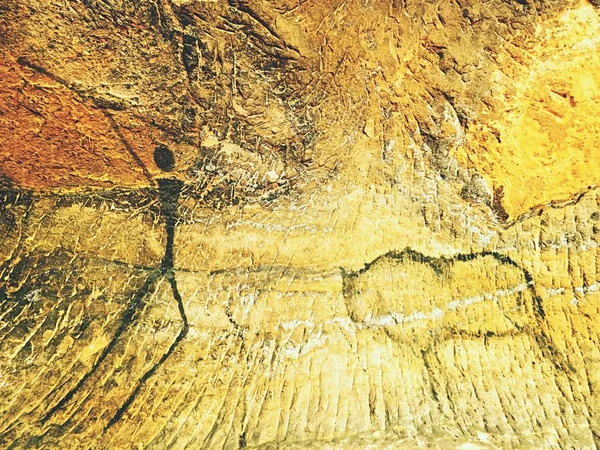 Måla av människans jakt på sandsten vägg, förhistoriska bilden. Svart abstrakt konst i sandsten grottan. — Stockfoto