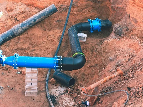 Plastic tubes joined with steel pipes with joint member and flange. — Stock Image Plastic tubes joined with steel pipes with joint member and flange. Royalty Free Stock Photos