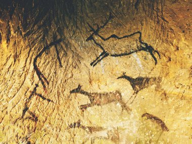 Geyikler, mamut ve Ren geyiği insan av boya. Tarihsel siyah karbon sanat