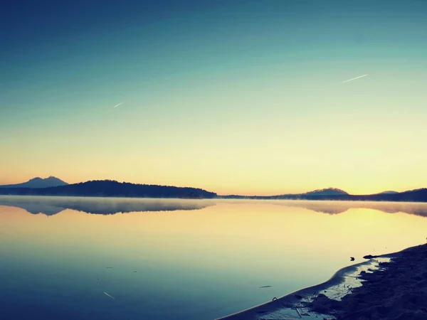 Beautiful sunrise at empty beach, Mediterranean Sea  island. Peaceful water level makes blue mirror — Stock Photo, Image