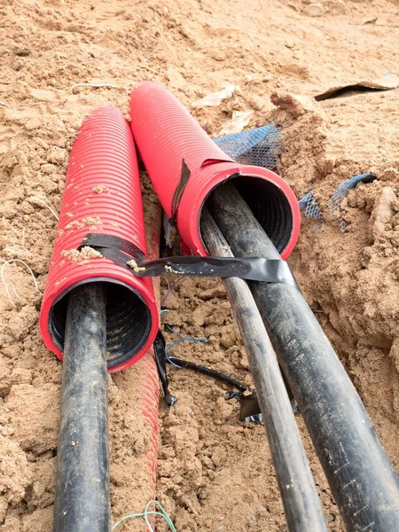 Wire in HDPE and protectivep tube. Building of lines of metallic and fiber optic cables, — Stock Image Wire in HDPE and protectivep tube. Building of lines of metallic and fiber optic cables, Stock Photo