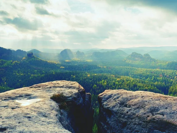 Rocky peak without people. View over wet sandstone peak into landscape — Stock Photo, Image