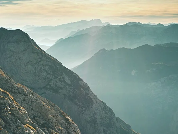 Contours of sharp mountains,  side by side increased from morning high humidity — Stock Photo, Image