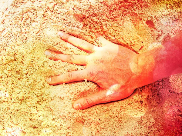 Film grain. Male hand in the salt sand on the beach. — Stock Photo, Image