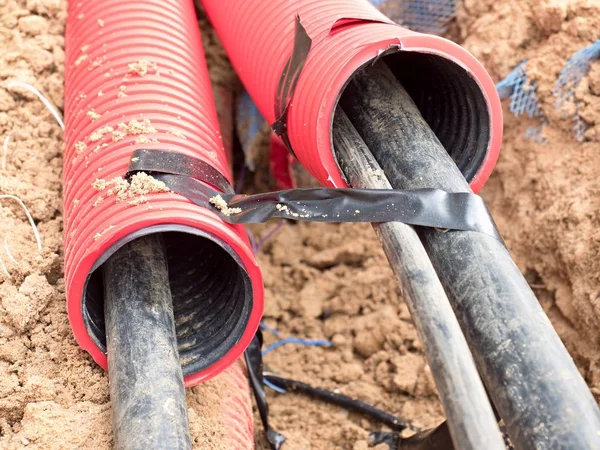 Wire in HDPE and protectivep tube. Building of lines of metallic and fiber optic cables, — Stock Image Wire in HDPE and protectivep tube. Building of lines of metallic and fiber optic cables, Stock Picture