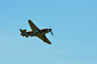 Memorial Airshow. Aircraft Jak-9 in aviation fair and century air combats. clipart