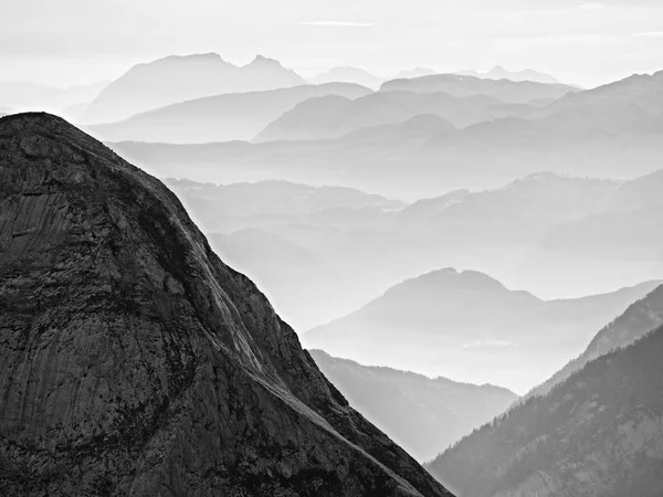 Spectacular aerial view of mountain silhouettes and misty valleys. Misty awaking of beautiful fairy valley — Stock Photo, Image