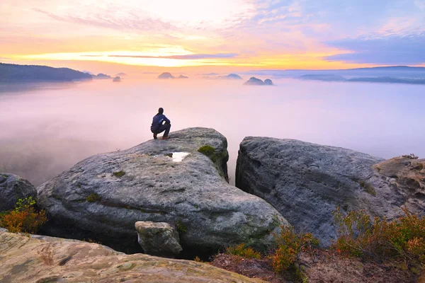 Sharp rear man silhouette on rocky peak. Satisfy hiker enjoy view. Tall man on rocky cliff — Stock Photo, Image