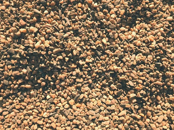 Természetes homokos talaj. Középpontjában a biztonsági játszótér kis kő föld — Stock Fotó