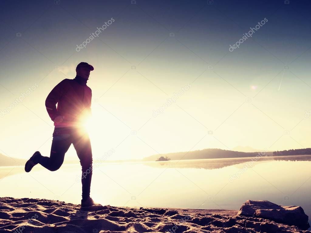 Man running at morning sea. Each day morning workout