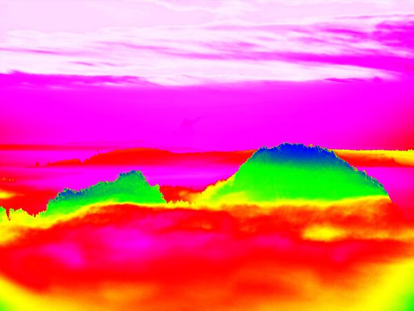 Thermography photo. Animal view. Spring landscape. Hills, forest and fog with chaned colors to ultraviolet.