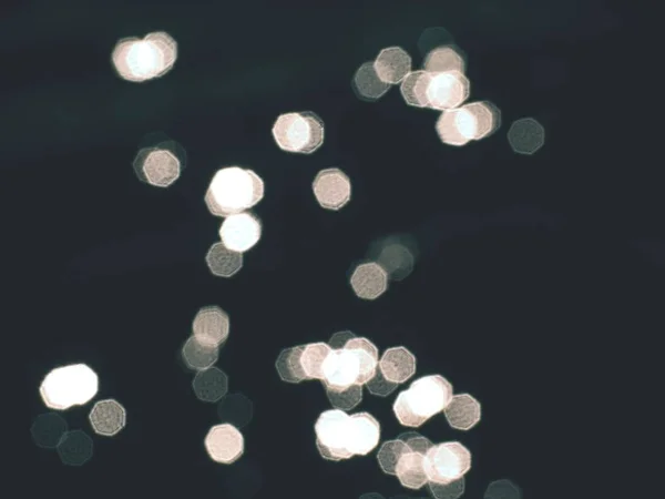 Stars in dark water. Out of focus bokeh background of blue water — Stock Photo, Image