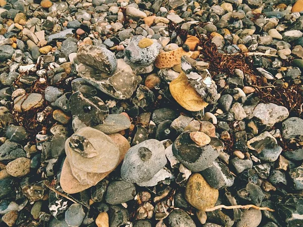 Havet pebble havet stenar bakgrund strand klippor. Bakgrund från havet stenar — Stockfoto