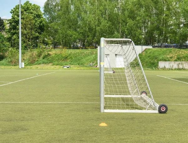 On football soccer field. Behind goal of soccer field. Soccer football net
