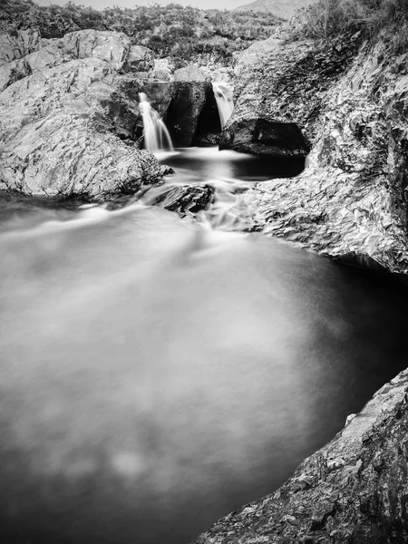 Multiple waterfalls on River Brittle  with cold swimmable pools. Black and white — Stock Photo, Image