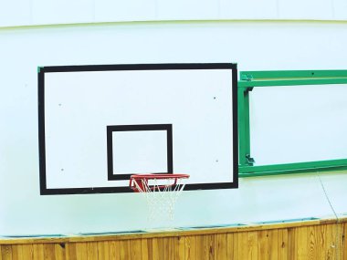 Basketball hoop in the high school gym. Sporting hall clipart