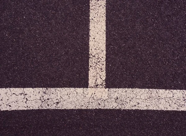 Detailof the asphalt floor with white stripes in kids sport park — Stock Photo, Image