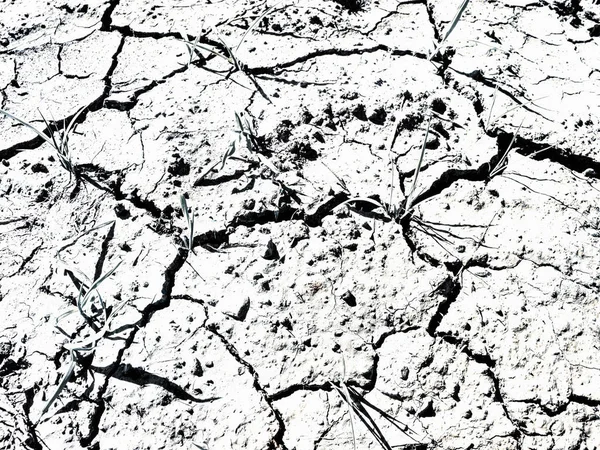 Dry mud ground with crack texture and granite gravel — Stock Photo, Image