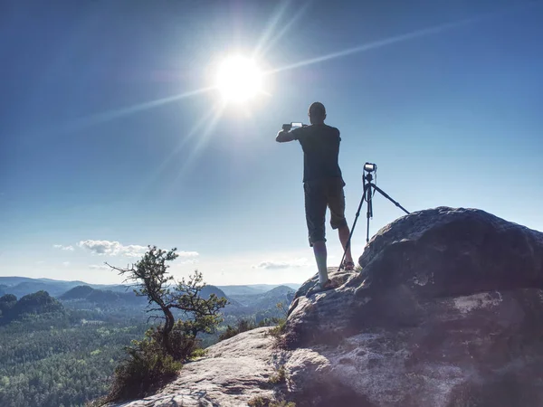 Photographer take photo by smart phone while set tripod — Stock Photo, Image