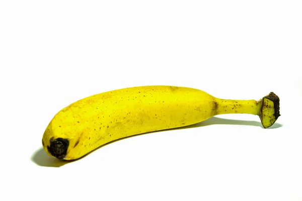 Banane unique sur fond blanc, vraie banane — Photo