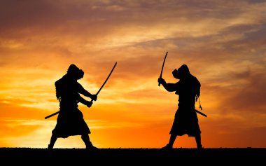Picture with two samurais and sunset sky clipart