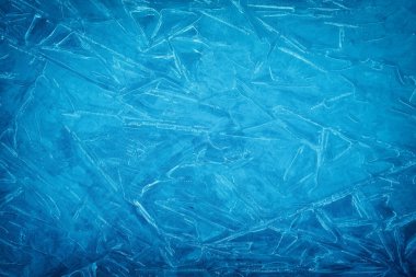 Background of blue cold winter ice. Texture of frozen surface. F