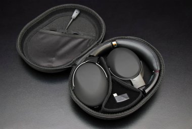 Modern gaming headphones with a microphone in a case.