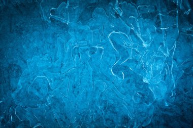 Background of blue cold winter ice. Texture of frozen surface. F