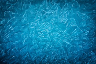 Background of blue cold winter ice. Texture of frozen surface. F