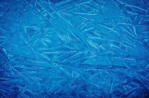 Background of blue cold winter ice. Texture of frozen surface. F — Stok fotoğraf