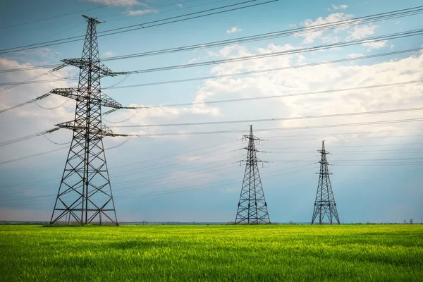 High Voltage Lines Power Pylons Flat Green Agricultural Landscape Sunny — Stock Photo, Image