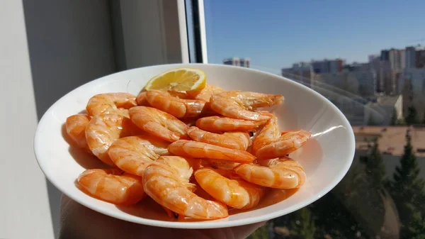 Kitchen and food, cooked shrimp, shrimp in a plate. Boiled shrimp with lemon. roasted prawns on white plate,