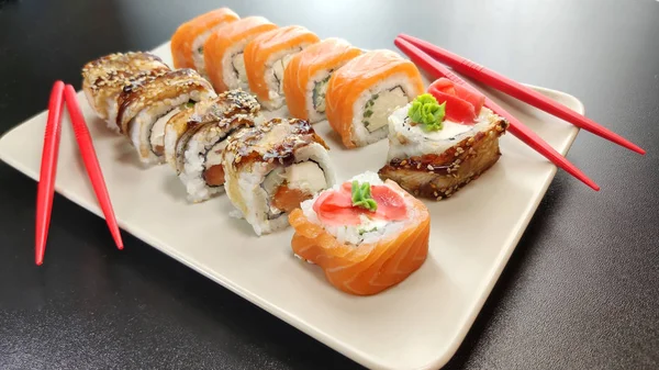 Japanese seafood sushi. Philadelphia and Canada sushi rolls on a plate