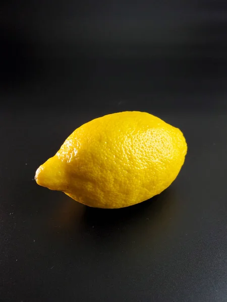 fresh lemon isolated on a black background