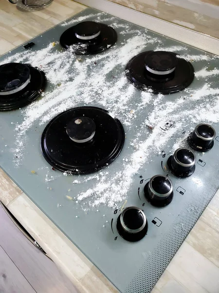 Cleaning powder on the gas stove, washing the stove