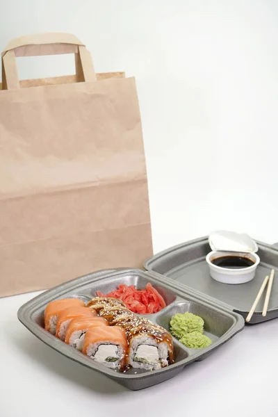 takeaway Lunch, delivery of sushi menu in lunch boxes. The concept of delivery