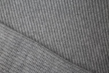 Gri örülmüş kumaş dokusu. Yünden yapılmış ürünler. El işi