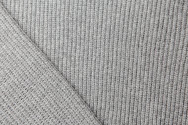 Gri örülmüş kumaş dokusu. Yünden yapılmış ürünler. El işi