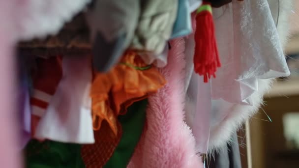 Wardrobe full of childrens carnival costumes — Stock Video